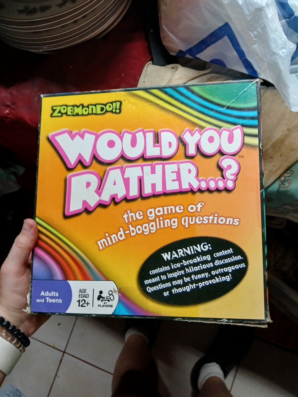Zobmondo "Would You Rather...?" board game featuring a vibrant, rainbow-colored